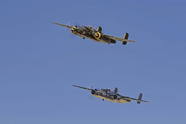 Airplane B-25 Mitchell bombers flying in formation at the airshow Stock Photo
