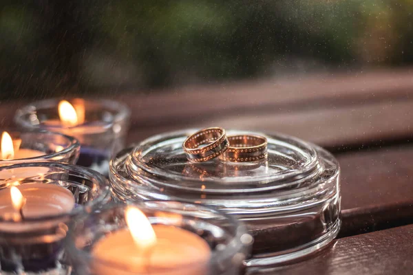 Gold Rings Stones Brown Background Candles — Stock Photo, Image