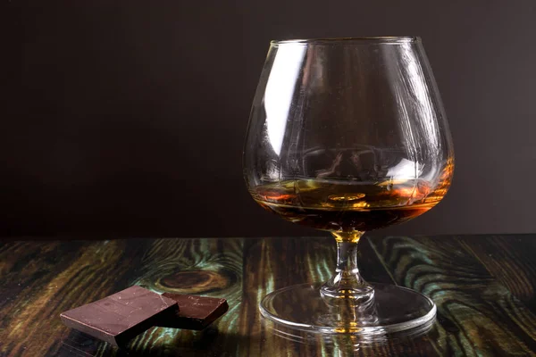 Glass Cognac Dark Chocolate Dear Elite Alcohol Dark Brown Background — Stock Photo, Image