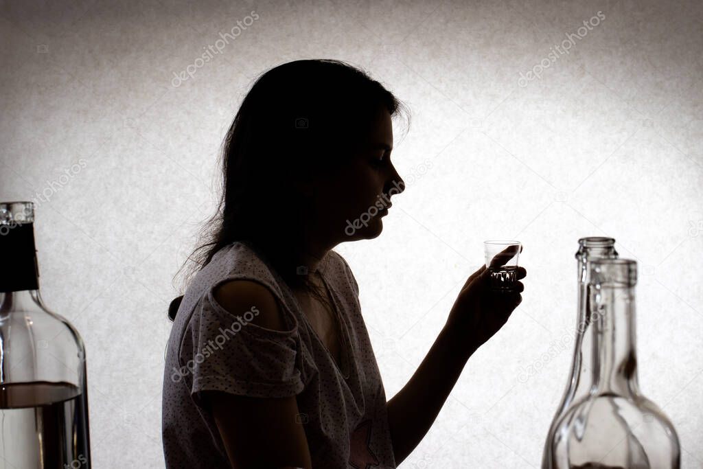 Woman with alcohol. Female alcoholism, depression, and delirium tremens. Alcohol addiction.