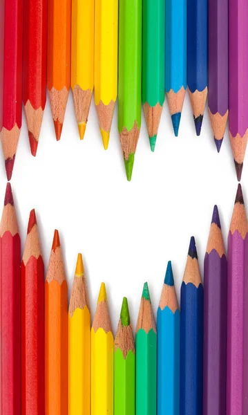 Heart shape colored pencils. Art and fun background