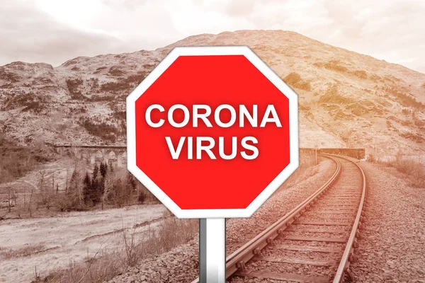 Corona virus warning sign on the railway tracks