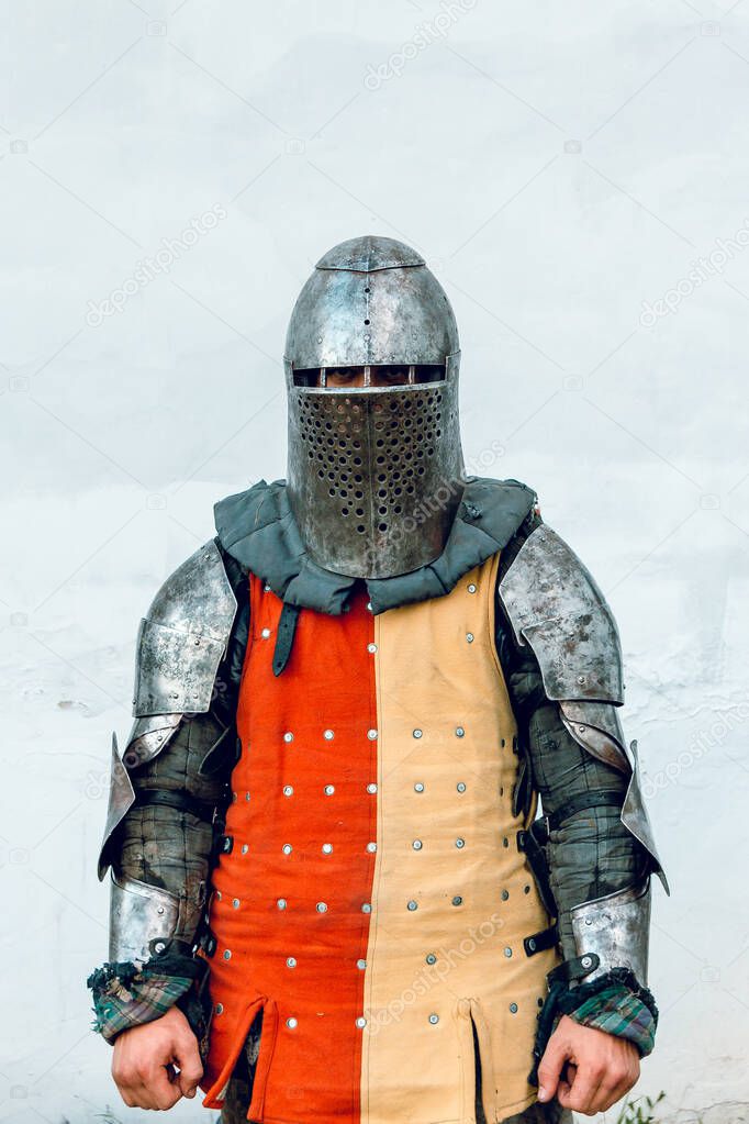 Knight in an old helmet. White background.