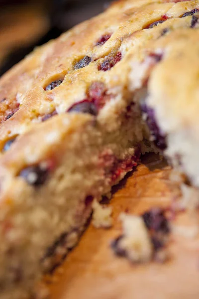 Berry and Currant Fruit Sponge country slice Cake in a cafe coffee shop