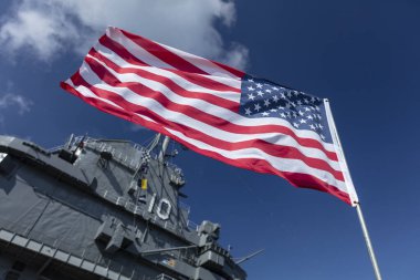 Charleston, South Carolina, United States, Novemner 2019, us flag the stars and stripes with the uss yorktown clipart