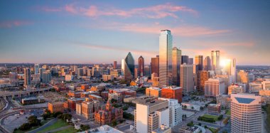 Dallas, Texas cityscape with blue sky at sunset in USA clipart