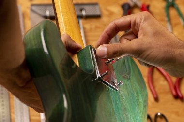 luthier working on repairing a guitar clipart