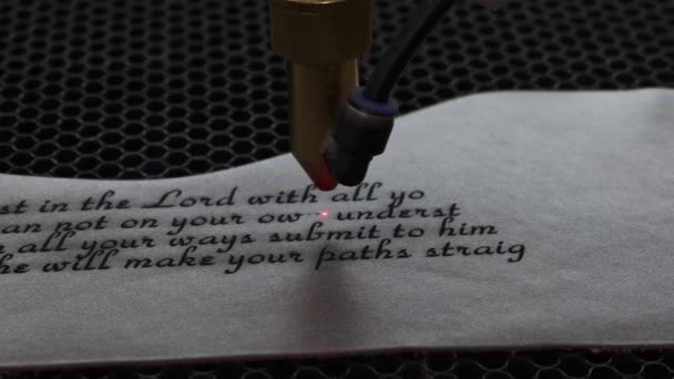 Close Footage Laser Machine Engraving Holy Bible Quote Leather Sheet — Stock Video