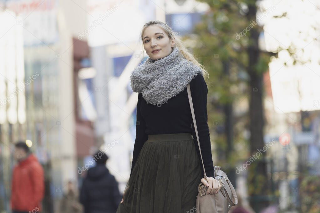 Portrait of a young woman sightseeing in Shibuya (Tokyo, Japan)