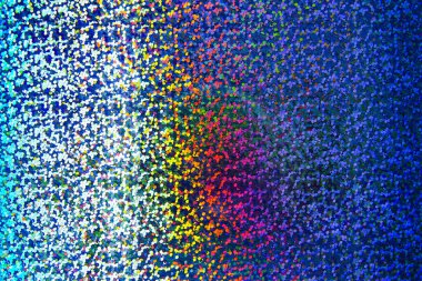 Hologram etiketinin soyut şablonu, yakın çekim yapılabilen bir mercekle kısmen fotoğraflanmış.