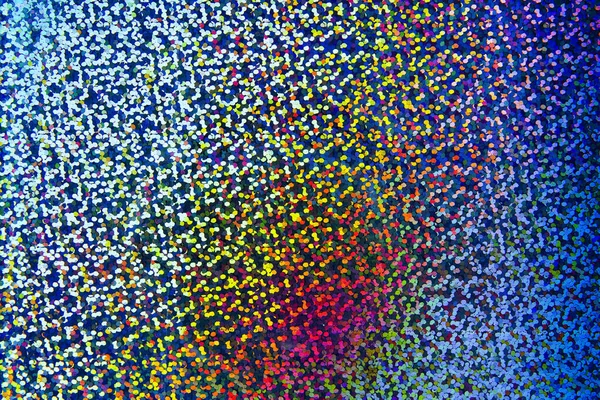 Abstract pattern of hologram sticker partially photographed with a lens that can be close-up