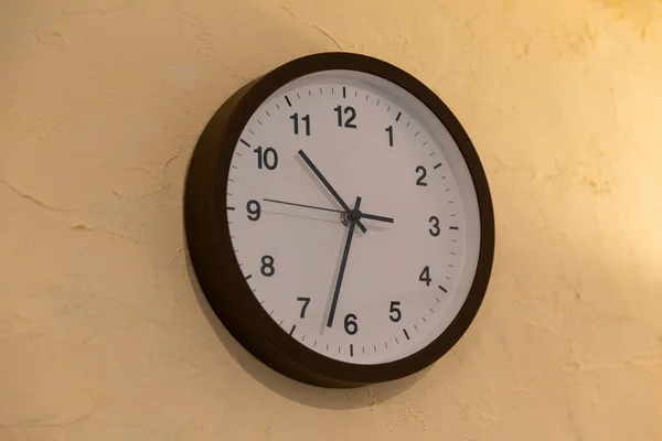 the clock installed on the wall of indoor residential space