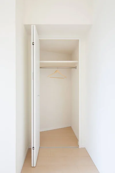 Storage space for clothes or luggage in the living room or bedroom