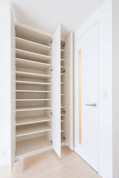 Storage space for clothes or luggage in the living room or bedroom