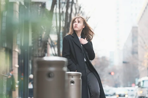 Young woman meeting with lover on the street of the city