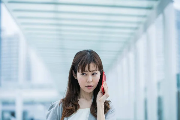 Asian Female Business Person Calling Smartphone Troubled Expression — Stock Photo, Image