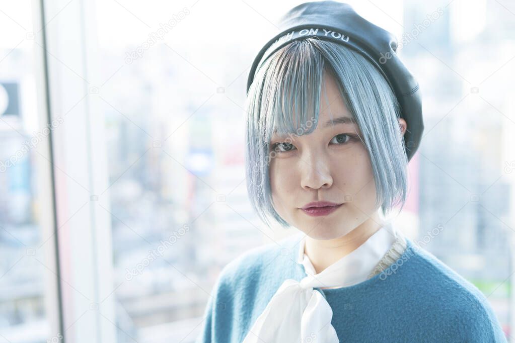 Young Asian woman with blue hair in Shibuya (Tokyo, JAPAN)