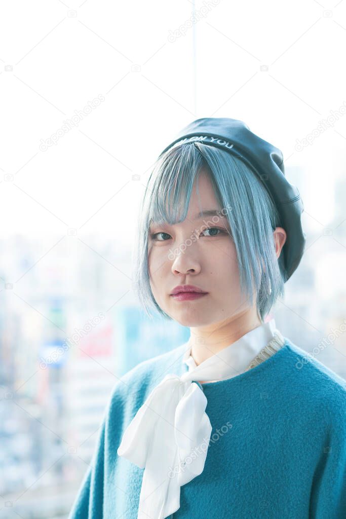 Young Asian woman with blue hair in Shibuya (Tokyo, JAPAN)