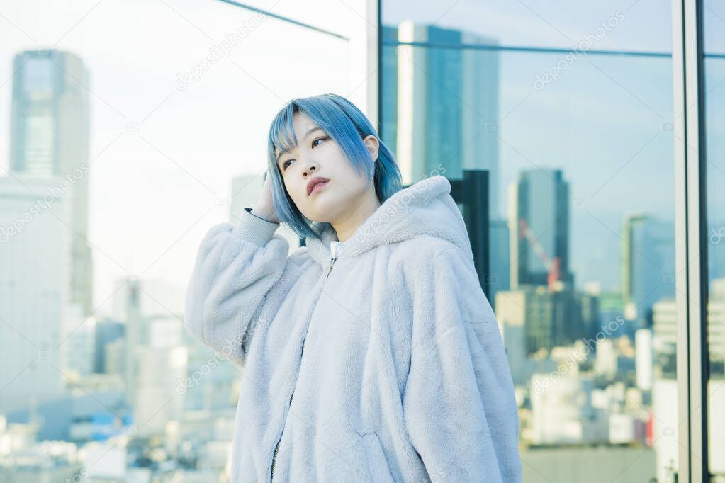 Young Asian woman with blue hair in Shibuya (Tokyo, JAPAN)