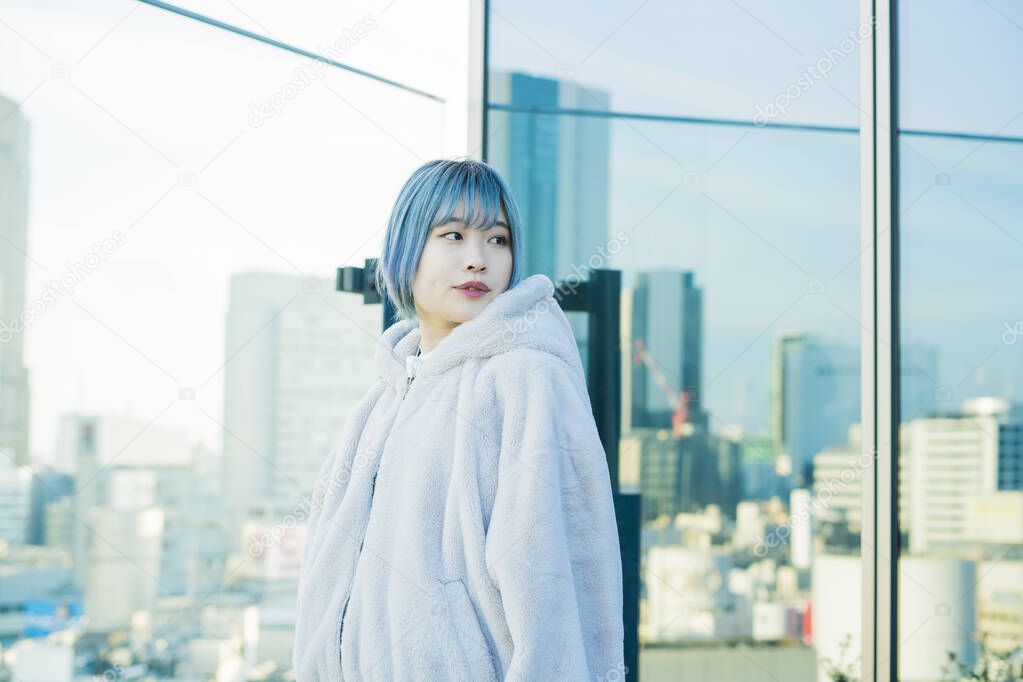 Young Asian woman with blue hair in Shibuya (Tokyo, JAPAN)