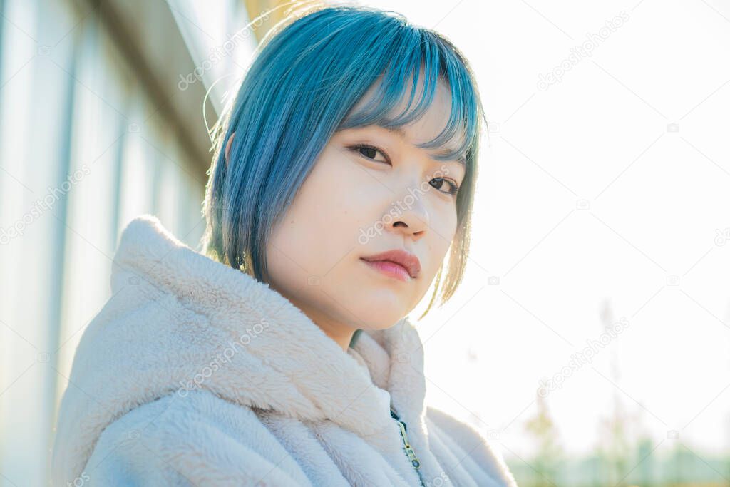 Young Asian woman with blue hair in Shibuya (Tokyo, JAPAN)