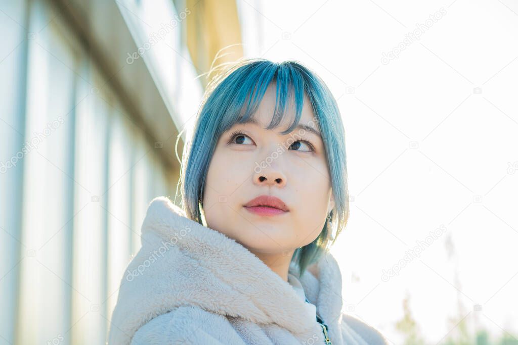 Young Asian woman with blue hair in Shibuya (Tokyo, JAPAN)