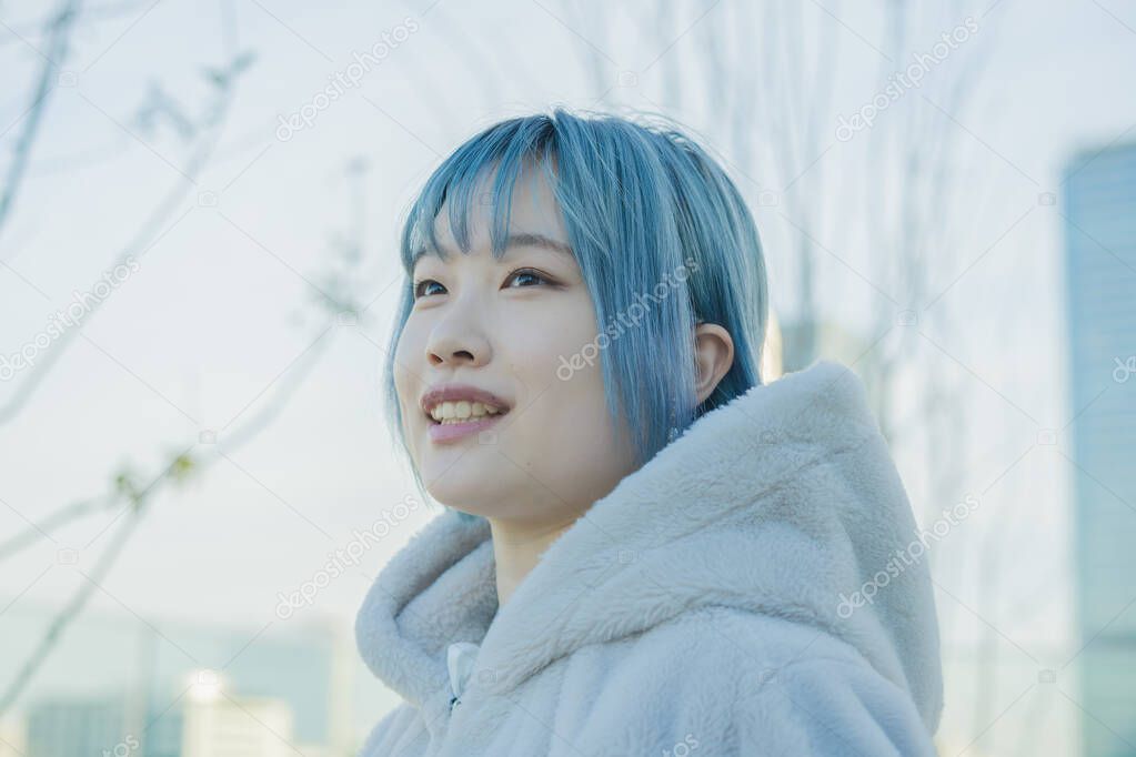 Young Asian woman with blue hair in Shibuya (Tokyo, JAPAN)