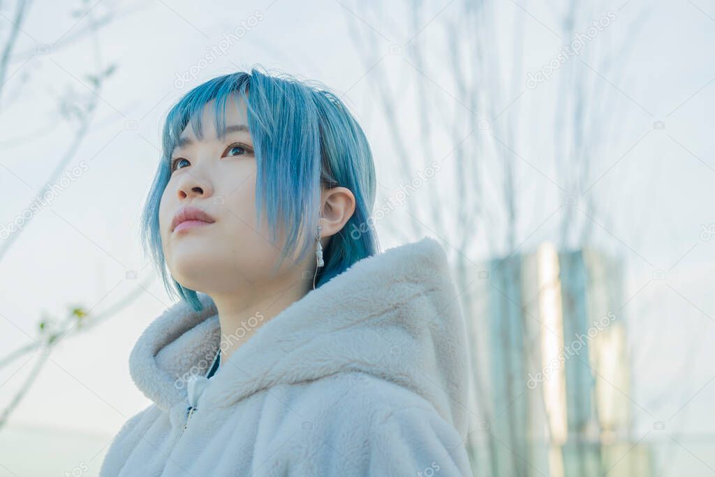 Young Asian woman with blue hair in Shibuya (Tokyo, JAPAN)