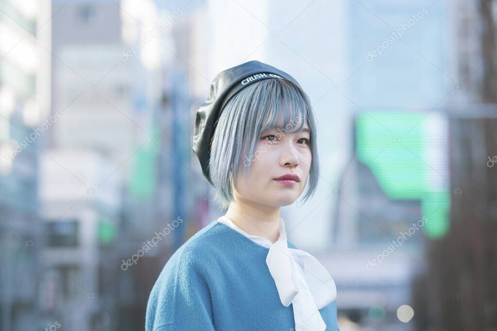 Young Asian woman with blue hair in Shibuya (Tokyo, JAPAN)