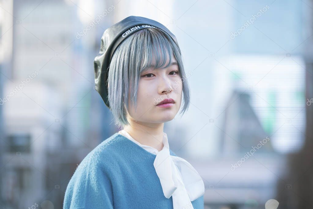 Young Asian woman with blue hair in Shibuya (Tokyo, JAPAN)