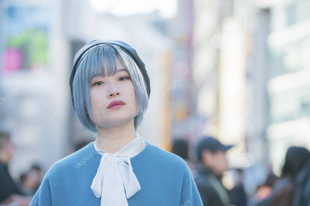 Young Asian woman with blue hair in Shibuya (Tokyo, JAPAN)