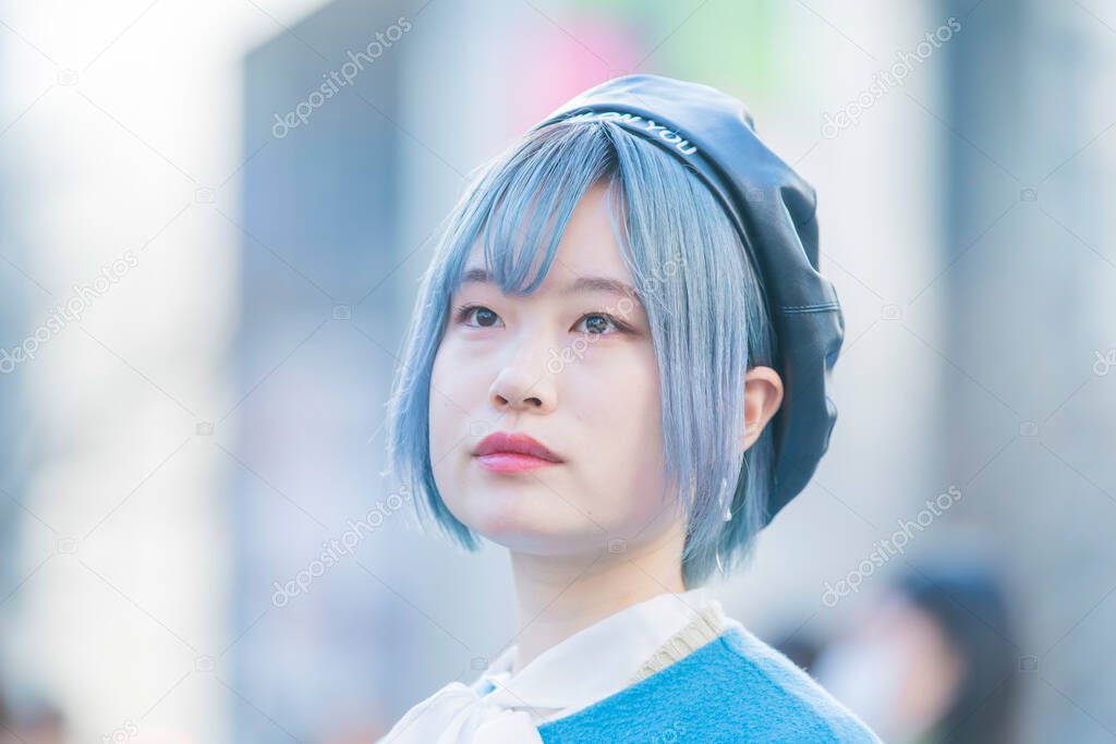 Young Asian woman with blue hair in Shibuya (Tokyo, JAPAN)