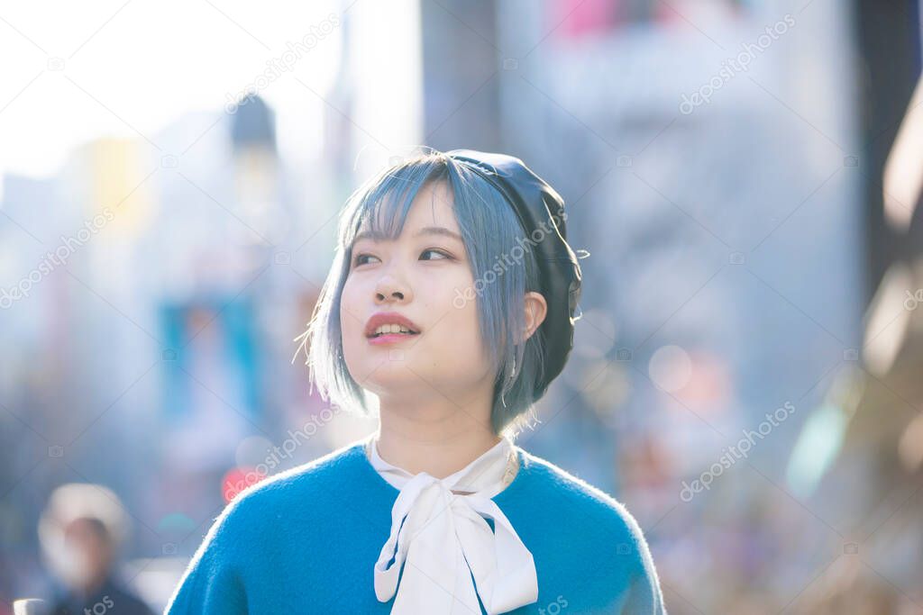 Young Asian woman with blue hair in Shibuya (Tokyo, JAPAN)