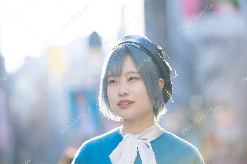 Young Asian woman with blue hair in Shibuya (Tokyo, JAPAN)