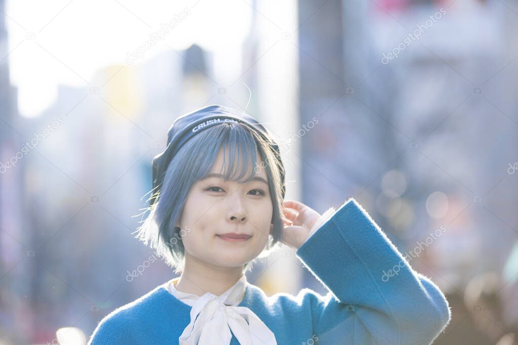 Young Asian woman with blue hair in Shibuya (Tokyo, JAPAN)