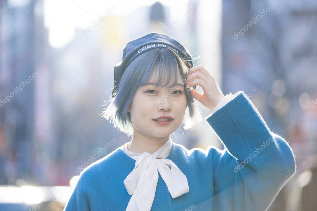 Young Asian woman with blue hair in Shibuya (Tokyo, JAPAN)