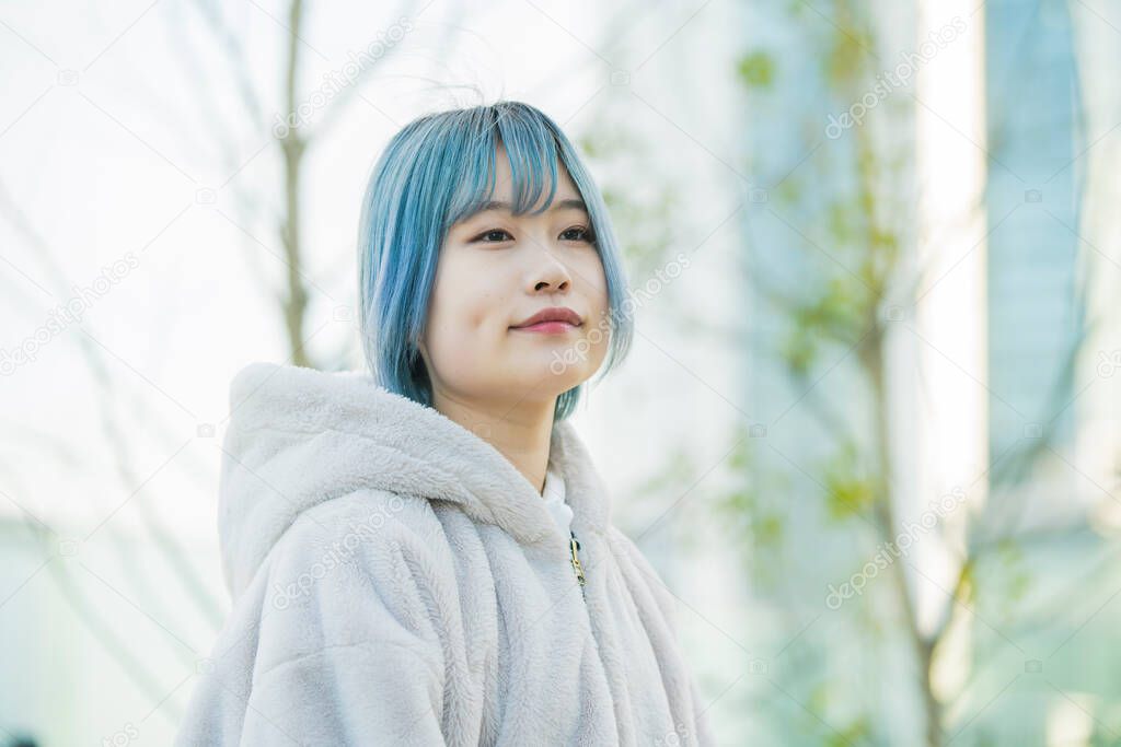 Young Asian woman with blue hair in Shibuya (Tokyo, JAPAN)