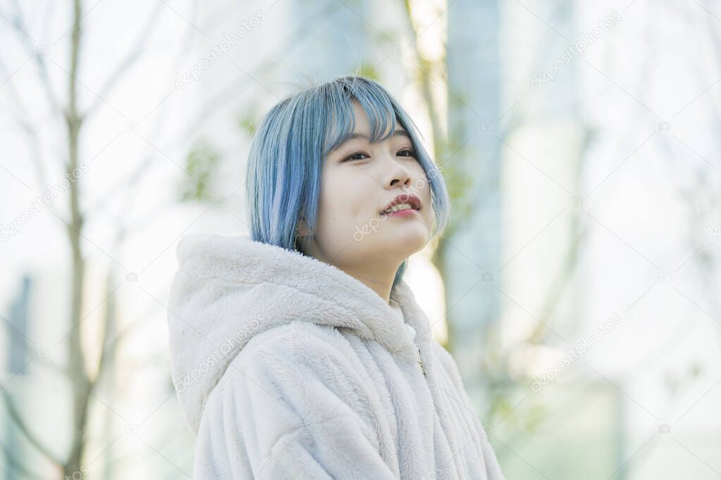 Young Asian woman with blue hair in Shibuya (Tokyo, JAPAN)