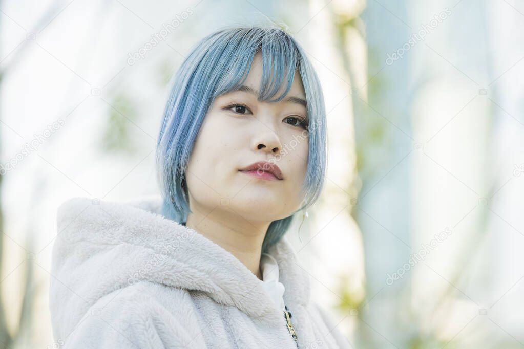 Young Asian woman with blue hair in Shibuya (Tokyo, JAPAN)