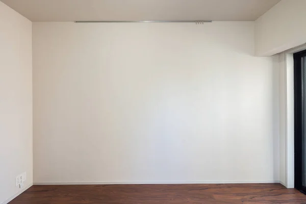 Living space and wall in a newly built apartment with no furniture