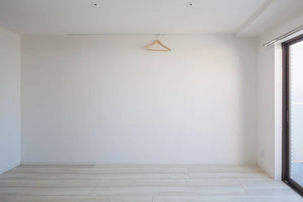 Living space and wall in a newly built apartment with no furniture