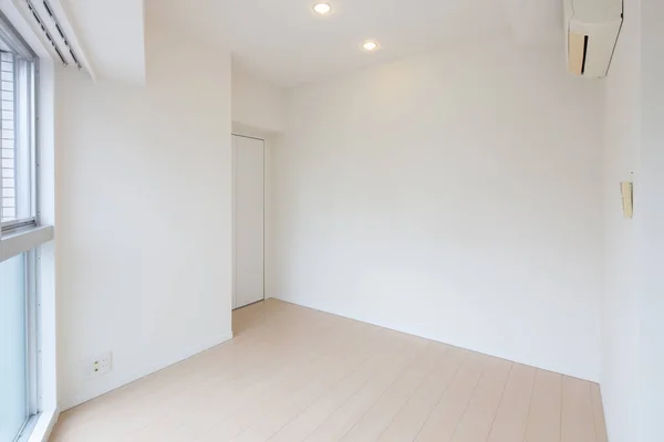 Living space and wall in a newly built apartment with no furniture