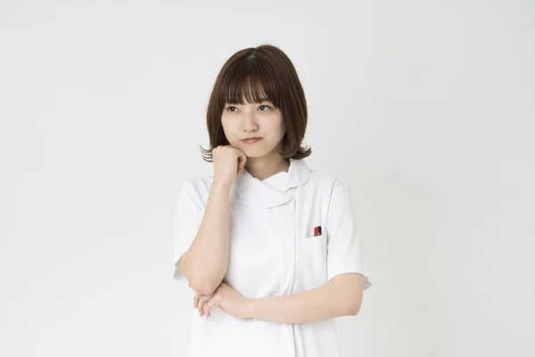 Asiatische Japanische Krankenschwester Die Ihr Gesicht Neigt Und Zweifel Empfindet — Stockfoto