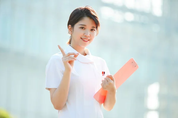 Asian Japanese Female Nurse Posing Her Index Finger Raised — Stock Photo, Image