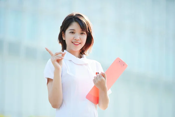 Asian Japanese Female Nurse Posing Her Index Finger Raised — Stock Photo, Image