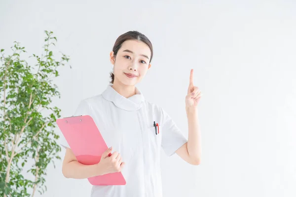 Asian Japanese Female Nurse Posing Her Index Finger Raised — Stock Photo, Image