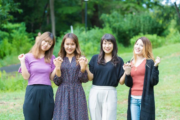 Four Asian Young Women Holding Hands Cheering Park — Stock Photo, Image