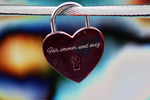 Pendant lock on bridge, heart shape. Forever and ever engraved — Stock fotografie
