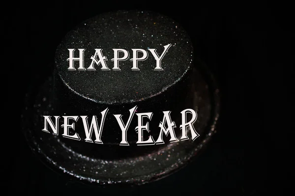 Cylinder on black background, New Year's Eve — Stock Photo, Image