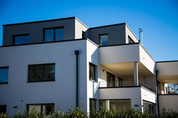 modern multi family house in munich, blue sky